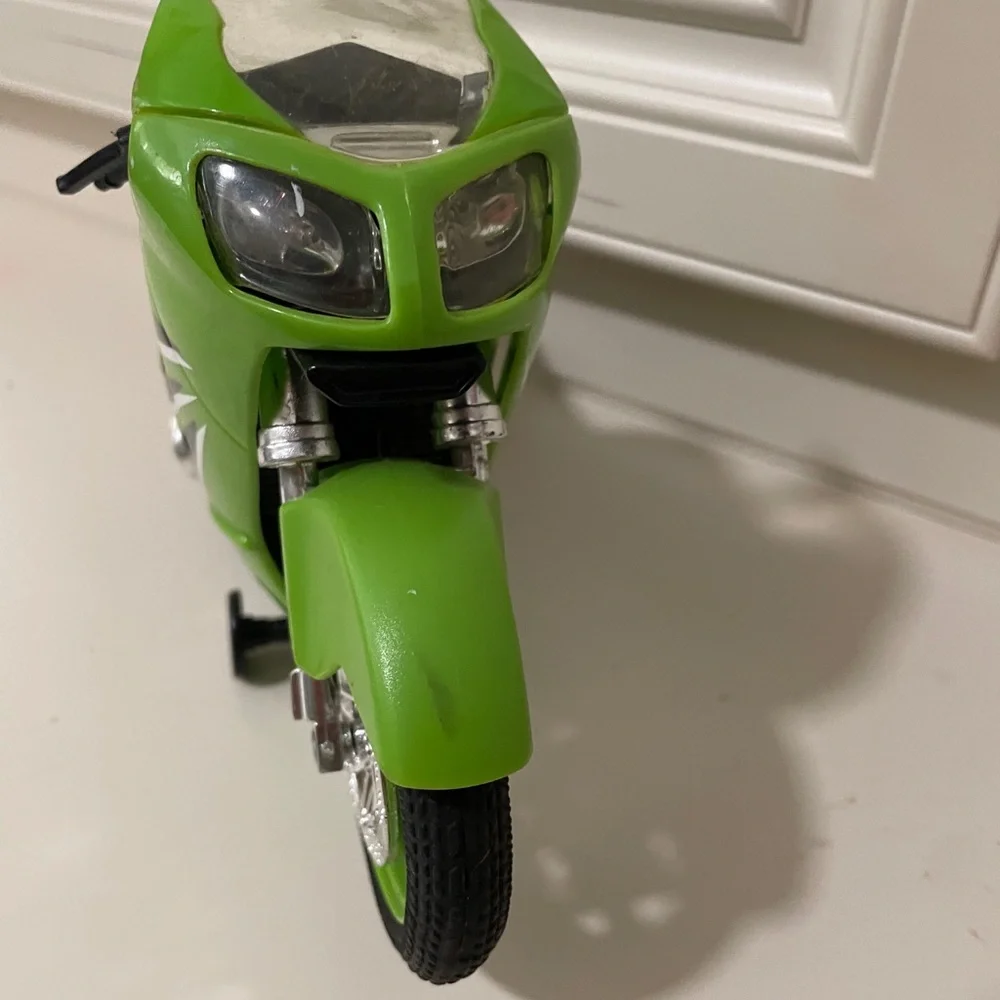 Ninja Green Kids Motorcycle Toy - wheel is missing side is broken